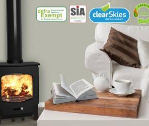 Saltfire ST-X4 wood burning stove in a living room with Ecodesign, SIA and Clearskies certification logos