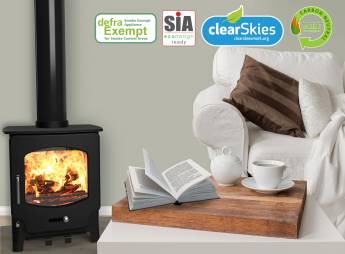 Saltfire ST-X4 wood burning stove in a living room with Ecodesign, SIA and Clearskies certification logos